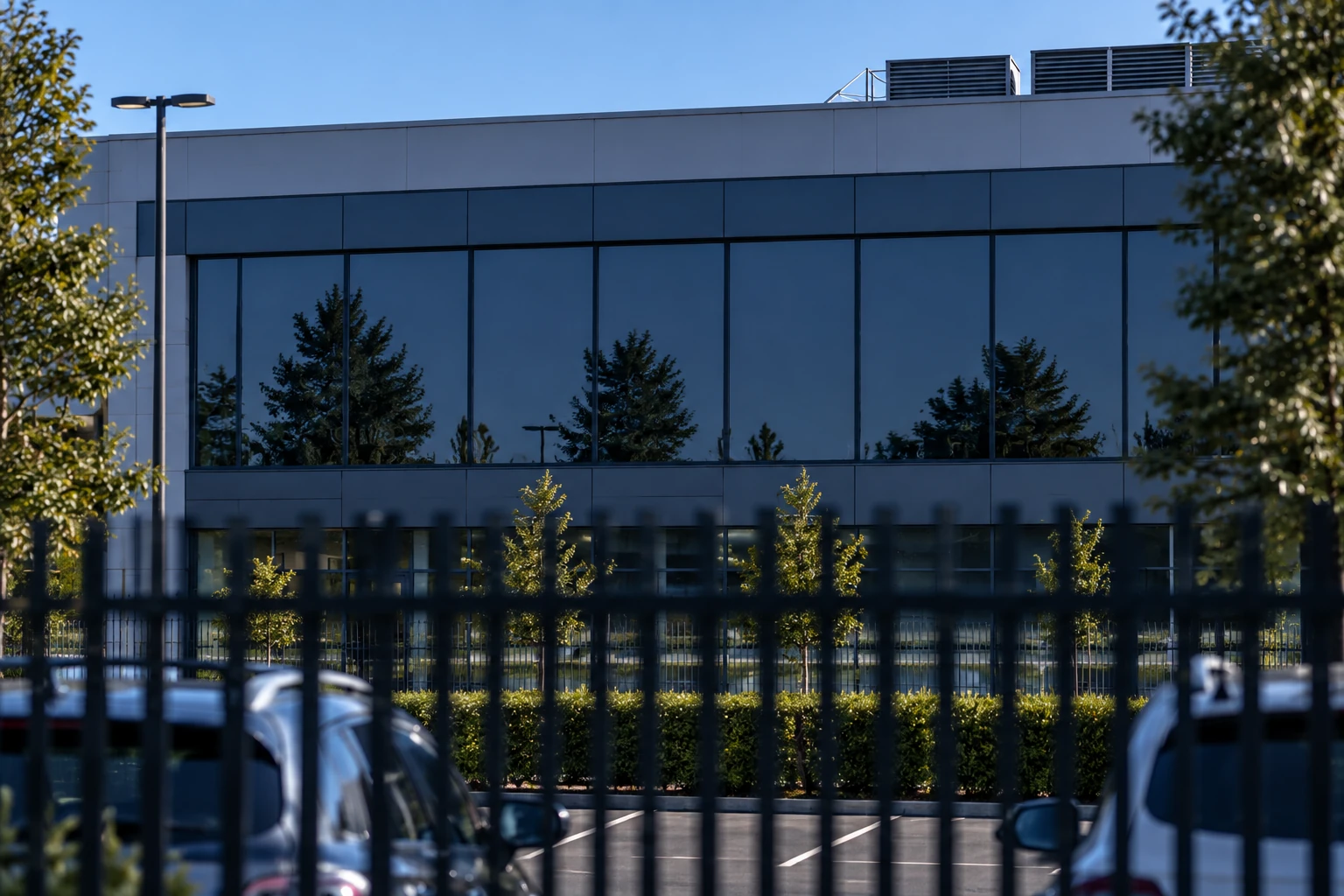 The same facility during the day with reflective glazing concealing the interior